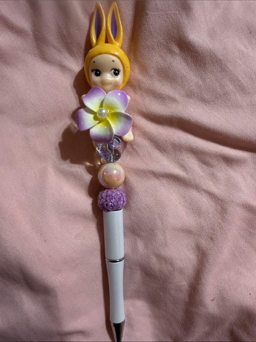 Yellow & Purple Sonny Angel with flower.
